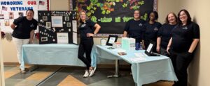 Sovah Health nurses stand with presentation boards